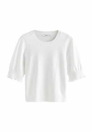 Haut en tricot blanc avec un col rond et des manches courtes bouffantes avec des détails froncés. Texture lisse et coupe décontractée.