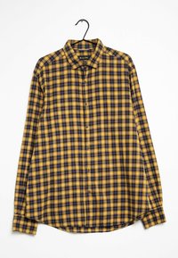 Chemise à carreaux bleu marine et jaune, à manches longues, à boutons avec col. Présente un ourlet arrondi et une coupe ample.