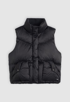 Black puffer vest with a high collar, featuring two front pockets with snap closures and a quilted texture. Material appears soft and insulated.