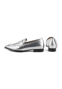 Silver metallic loafers with a flat black sole, featuring a wide band across the upper and a pointed toe design. Smooth texture throughout.