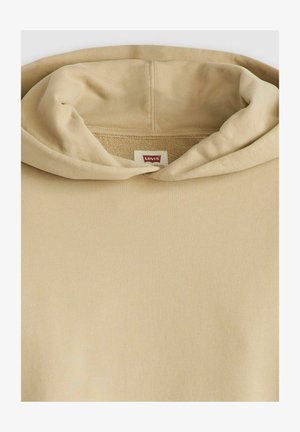 Beige hoodie with a soft, textured fabric. Features a large, cozy hood and a small, red Levi's label near the neckline.