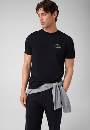 Guess, T-SHIRT MIT GESTICKTEM LOGO - T-shirt imprimé - schwarz