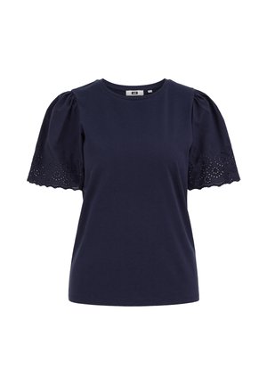 Blouse bleu marine à manches courtes avec manches bouffantes et broderie en dentelle ajourée sur les bords des manches.