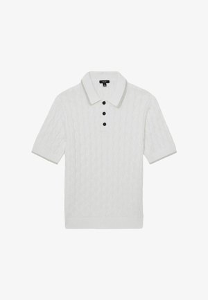 Valkoinen lyhythihainen kaapelisukkeneuletakki, jossa on kolme mustaa nappia ja kaulus, jossa harmaa reunus.