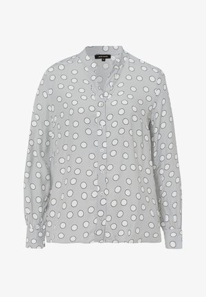 Camicia button-up grigia chiara realizzata in tessuto morbido, con motivi circolari neri e un colletto, maniche lunghe e polsini con bottoni.