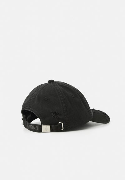 Black cotton baseball cap with adjustable metal buckle strap and subtle distressed details, shown from rear right side on white background.