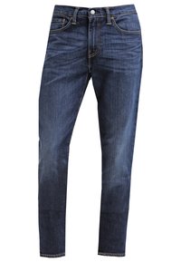 Mörkblå denimjeans med rak passform, som har knäppning med knapp, fem fickor och subtila blekningar. Förstärkt sömnad vid sömmarna.