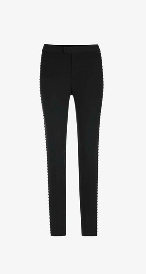 Schwarze, schmal geschnittene Hose mit Perlenbesatz entlang der äußeren BeinNähte, mit einem Bund und verschluss auf der Vorderseite.