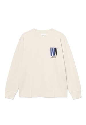 Kremowa bluza z okrągłym dekoltem i długimi rękawami, z prążkowanymi mankietami i nakładającym się niebiesko-czarnym logo "WW" na lewej piersi.