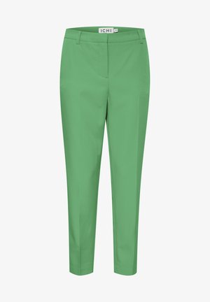 Vihreät, muotoillut housut, joissa on sileä pinta. Edessä tasainen leikkaus, sivutaskut ja kapea malli. Brändin etiketti näkyvissä vyötäröjäljessä.