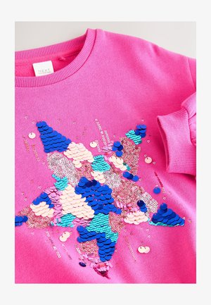 Roze sweatshirt met een sterontwerp van meerkleurige pailletten in blauw, roze en turquoise, met overal glinsterende accenten.