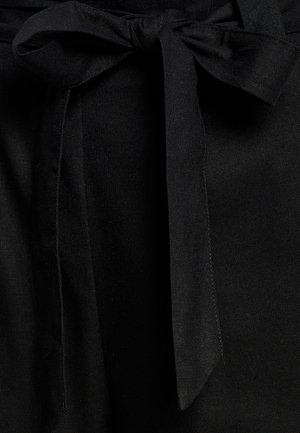 Black fabric with a textured surface, featuring a tied bow and a straight cut design. The fabric appears durable and smooth.