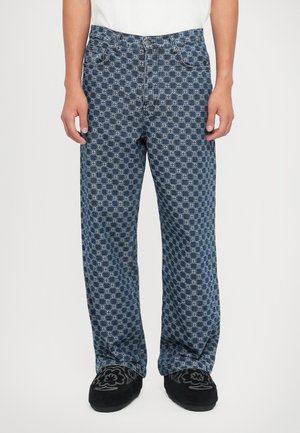 Blå denimjeans med et geometrisk mønster, i lige pasform, med forlommer og kontrasterende stikninger.