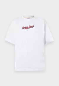 Valkoinen puuvillainen t-paita rento istuvuus, jossa on punainen ja sininen "Guess Jeans" -logo brodeerattuna rinnan ylle. Lyhyet hihat.