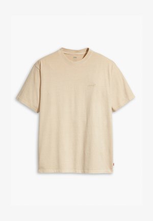 T-shirt in cotone beige con collo rotondo e maniche corte. Presenta un sottile logo "Levi's" dello stesso colore sul petto. Tessuto morbido.