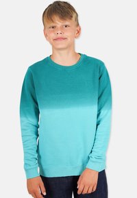 Turkoosi huppari, jossa on gradienttimuotoilu, ribbaatut hihansuut ja kaula-aukko, sekä hienovarainen logo rinnassa.