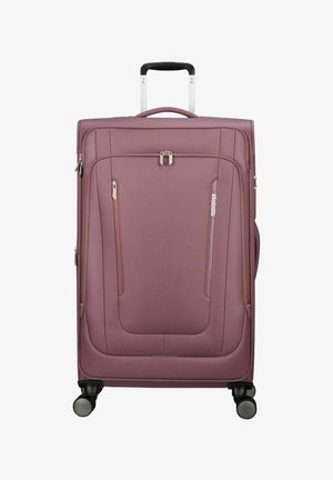 Grande valise souple mauve avec poignée télescopique, poches avant zippées, quatre roulettes pivotantes et logo de la marque American Tourister à l'avant.