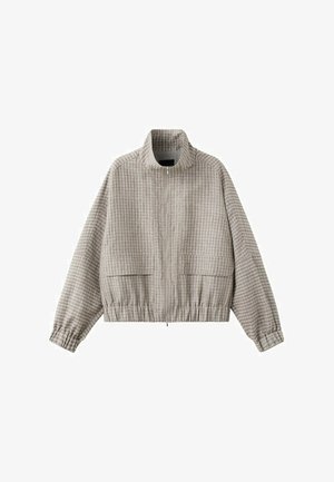Veste zippée à carreaux beige et gris clair avec col montant, manches longues, ourlet élastiqué et poches avant à rabat.