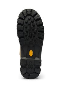 Svart gummistövelfot med djupa mönster, cirkulära grepp och en gul Vibram-logotyp i mitten. Hållbar och utformad för grepp.