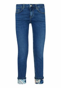 Jeans ajustados de denim azul con tobillos remangados que muestran un forro de tela floral y paisley colorido, botón en el frente y bolsillos visibles.