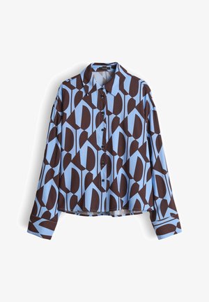 Blouse à manches longues présentant un motif géométrique en marron et bleu clair, avec un col et des boutons noirs sur le devant. Tissu à texture lisse.