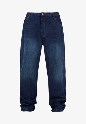 Tmavě modré džíny s volným střihem, které mají pět kapes, zapínání na knoflík a viditelné švy.