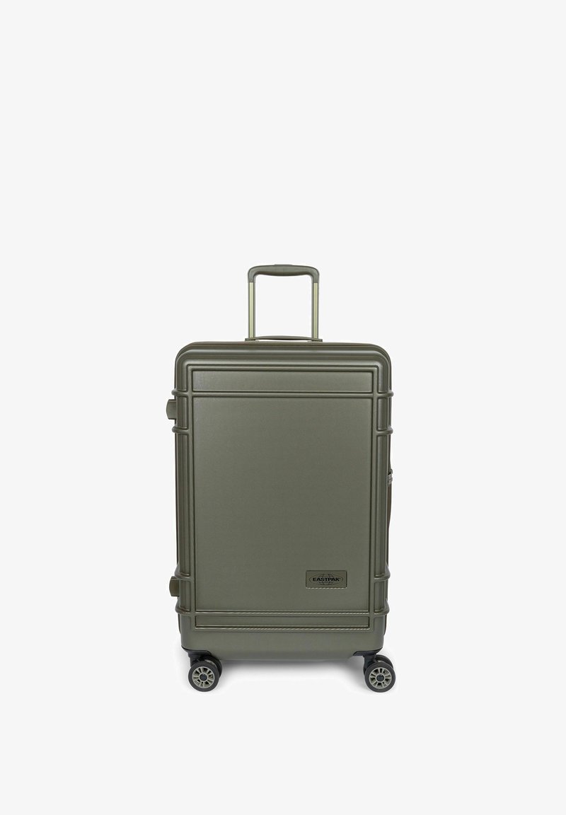 Valise rigide de couleur vert olive, dotée d'une finition texturée, d'une poignée rétractable et de quatre roues pivotantes pour faciliter la mobilité.