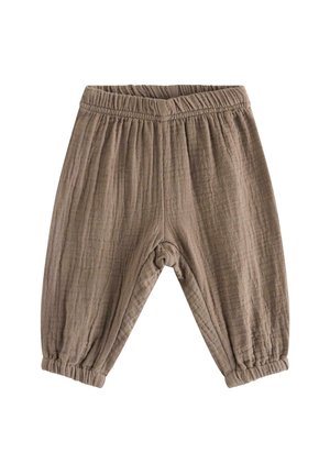 Bløde, lysebrune bukser til småbørn med elastik i talje og ved ankelmanchetter, lavet af tekstureret, åndbart stof.
