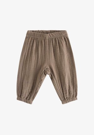Bløde, lysebrune bukser til småbørn med elastik i talje og ved ankelmanchetter, lavet af tekstureret, åndbart stof.