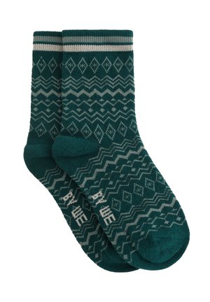 Teal-mønstrede sokker med et diamant- og bølgemønster i grå. Strikket tekstur med vandrette striber ved anklen.