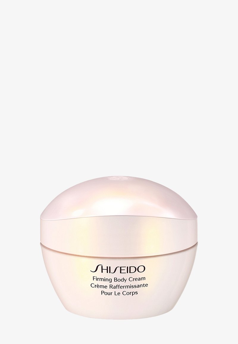 Shiseido kiinteyttävä vartalovoide helmiäisenvalkoisessa, pyöreässä purkissa, jossa musta teksti englanniksi ja ranskaksi valkoisella taustalla.