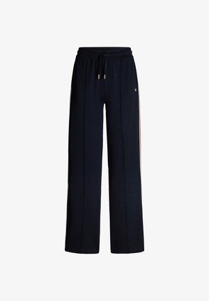 Marineblauwe sweatpants met een wijduitlopende pasvorm, elastische tailleband, trekkoordsluiting en crèmekleurige zijstrepen. Gemaakt van zachte, gestructureerde stof.