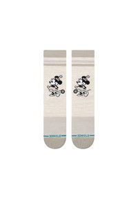 Beige socks with black and white cartoon character design. Features two horizontal stripes and blue brand logo at the bottom. Cotton blend material.