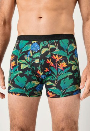 Puuvillaiset bokserishortsit, joissa on musta tausta ja värikkäitä trooppisia kukkakuvioita vihreänä, sinisenä ja oranssina. Kuminauhavyötärö, jossa logo.