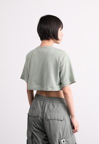 Nike Sportswear CROP TEE - Paprasti marškinėliai - jade horizon