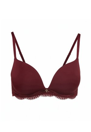 Bordeauxroze gewatteerde bh met verstelbare bandjes, kanten rand aan de onderkant en een klein decoratief detail in het midden. Gladde stofstructuur.