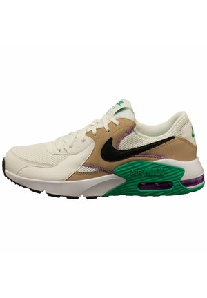 Nike Air Max Sneaker mit weißen, beigen, grünen und schwarzen Akzenten, ausgestattet mit einem Obermaterial aus Mesh und einer sichtbaren Luftpolsterung in der Sohle.