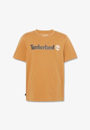 Oranje katoenen t-shirt met het "Timberland" logo in het zwart, met een witte boomicoon. Korte mouwen en ronde hals. Glad textuur.