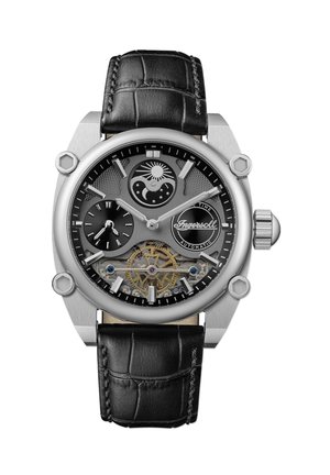 Montre avec bracelet en cuir noir et boîtier en acier inoxydable argenté. Présente un cadran détaillé avec des indicateurs de phase de lune et des engrenages visibles.