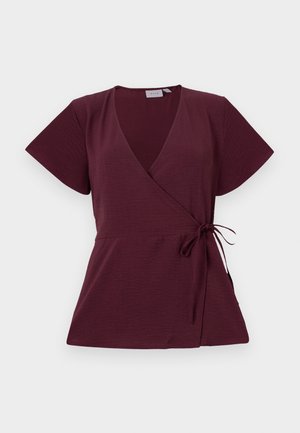 Burgundy wrap top with short sleeves, v-neckline, tie detail at the waist, and textured fabric. Simple and versatile design.