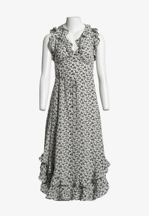 Robe noire et blanche à fleurs sans manches avec col et ourlet à volants, taille à cordon et jupe asymétrique superposée sur mannequin blanc.