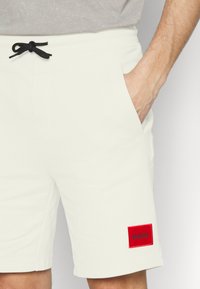 HUGO DIZ - Calças de fato de treino - natural