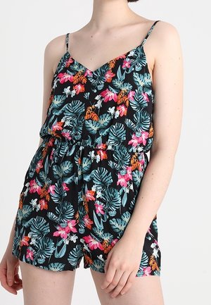 Combinaison à fleurs noires avec des fines bretelles, ornée de feuilles tropicales colorées et de fleurs en teal, rose et orange, élastiquée à la taille.