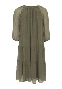 Robe ample vert olive avec des manches transparentes trois quarts et un subtil motif géométrique sur toute la robe.