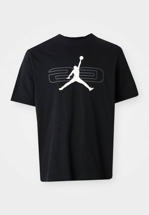 T-shirt in cotone nero con logo Jumpman bianco e grafica grigia "23" sul davanti. Collo a giro classico e maniche corte.