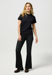 Wrangler MONTANA - Flared jeans - constellation