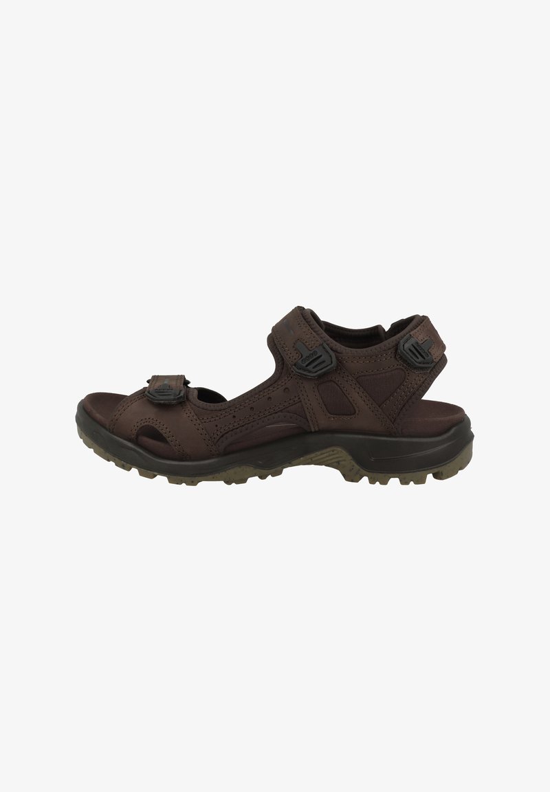 Brown outdoor sandal with open toe, adjustable Velcro straps, and rugged sole. Features perforated design for ventilation and traction.