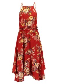 Robe d'été rouge sans manches avec fines bretelles, présentant des motifs floraux jaunes, crème et violets, avec un ourlet asymétrique.