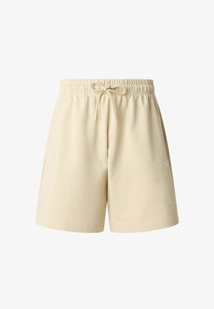 Light beige cotton shorts with an elastic waistband and adjustable drawstring. Features pockets and a small white logo on the side.