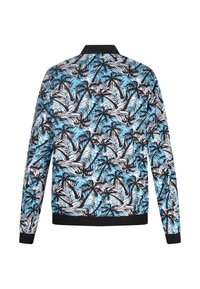 Langemouwige jas met een zwart, wit en blauw tropisch bladerenpatroon, voorzien van een geribde zwarte kraag en manchetten.